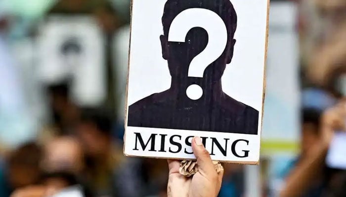 The representational image shows a person showing a notice for someone missing. — The News/File