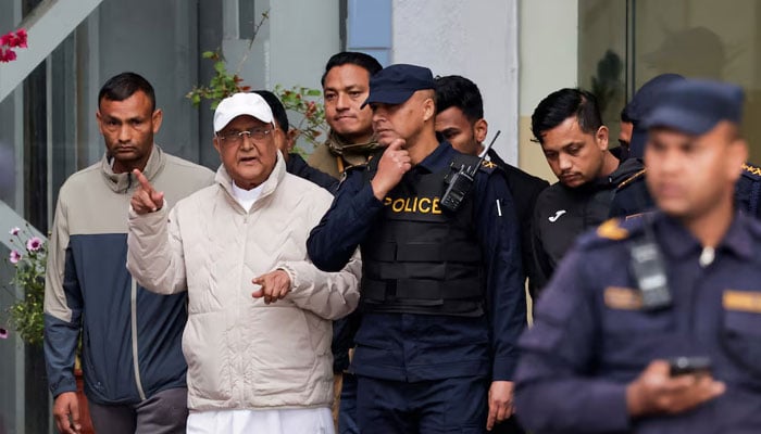 Former Nepal Prime Minister and Chairman of the Communist Party of Nepal, K.P. Sharma Oli gestures while being taken to a hospital from the District Police Range after his detention by police, who are investigating whether he was negligent in preventing dozens of deaths during the Gen Z protests, in Kathmandu, Nepal, March 28, 2026.—Reuters