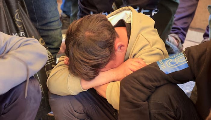 A mourner reacts during the funeral of Palestinian father Mahmoud Al-Bayouk and his two-year-old son Yahia, who were killed in an Israeli strike, according to medics, at Nasser Hospital in Khan Younis, in the southern Gaza Strip, March 31, 2026.—Reuters
