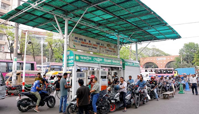 Motorists queue to refuel their motorcycles at a fuel station amid concerns over fuel supply amid the US-Israel conflict with Iran, in Dhaka, Bangladesh, March 15, 2026.—Reuters