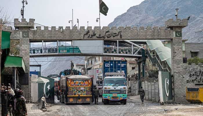 Afghan cargo trucks enter Pakistan at the Afghanistan-Pakistan Torkham border post on February 2, 2023. — AFP