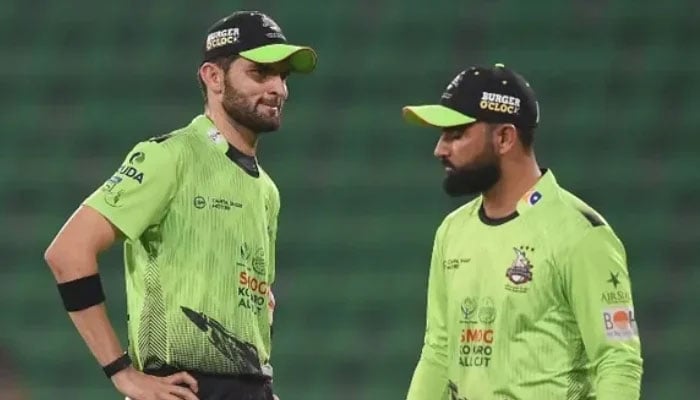 Lahore Qalandars’ captain Shaheen Shah Afridi (left) speaks with teammate Fakhar Zaman during the Pakistan Super League match between Karachi Kings and Lahore Qalandars at the Gaddafi Cricket Stadium in Lahore, March 29, 2026. — AFP