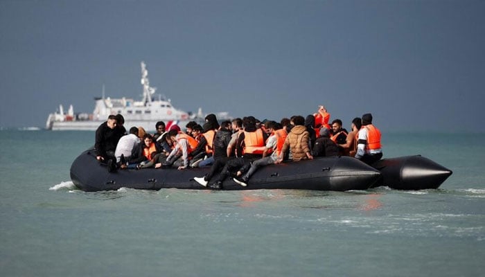 Migrants on an inflatable dinghy attempt to cross the English Channel to reach Britain, on the beach of the Slack dunes in Wimereux, France, 4 September, 2024. —Reuters