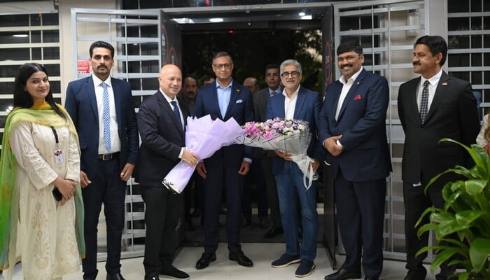 Mobilink and VEON Group officials pose for a picture at the launch event.