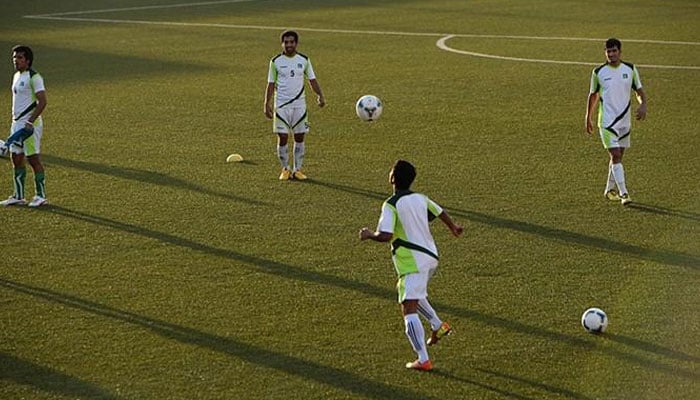 Players from the Pakistan football team during a practice session. — AFP/File