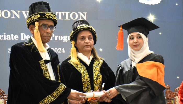 Federal Minister for Education Khalid Maqbool Siddiqui and Principal Prof Sadia Ibrar awarding a degree to a student during the 23rd Convocation of Model College for Girls G-10/4, in the Federal Capital on April 2, 2026. — Online