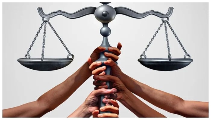 Representational image of hands holding scale of justice. — U Ottawa/File