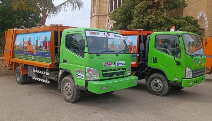 Sindh Solid Waste Management Board (SSWMB) trucks are seen in this image. — Facebook@sswmbo/File