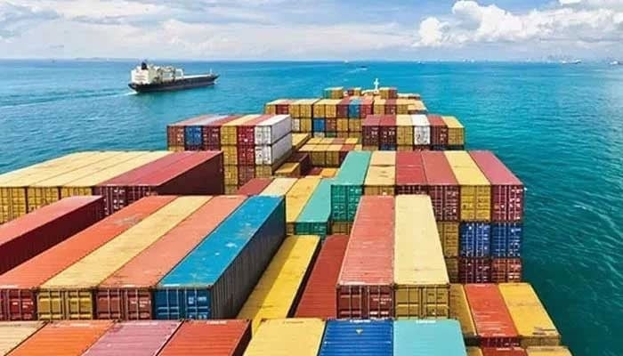 This undated photo shows a cargo ship carrying shipping containers as it sails through international waters. — Reuters/File