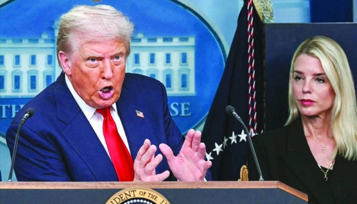 US President Donald Trump, alongside Attorney-General Pam Bondi (right), speaks during a news conference. —AFP/File