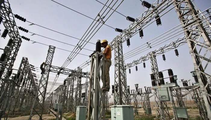 A representational image of a worker at a grid station in Hyderabad. — APP/File
