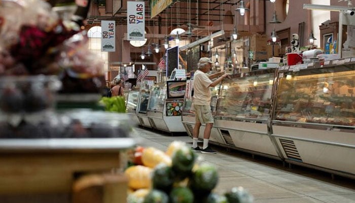 A man shops for meat at Eastern Market in Washington, U.S., August 14, 2024. — Reuters