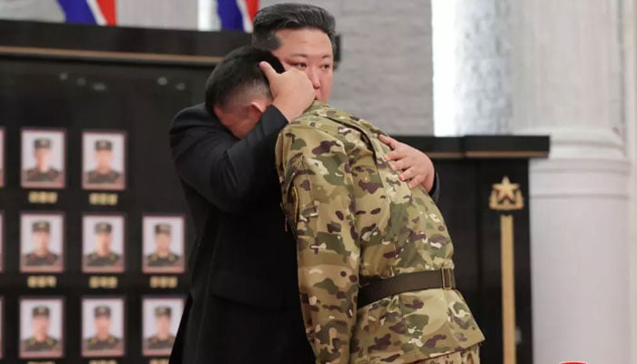 The images of an elaborate ceremony showed an overcome Kim presenting medals, placing them beside portraits of the fallen, and consoling the returned soldiers. — AFP/File