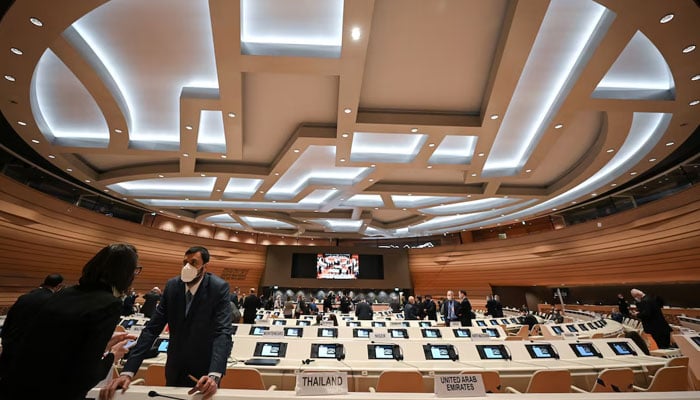 Delegates speak with each other prior to a session of the Conference on Disarmament in Geneva, Switzerland, March 1, 2022. — Reuters