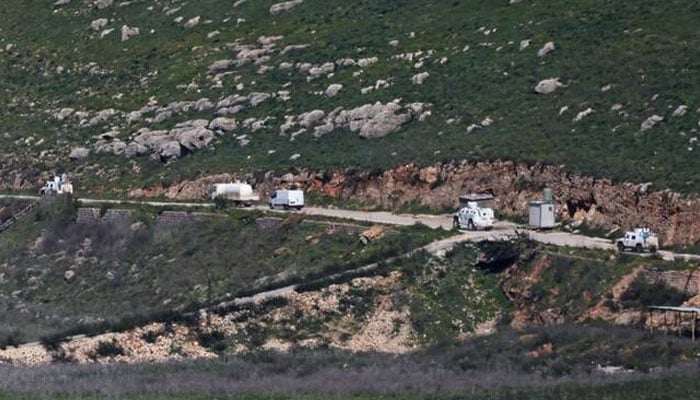This picture taken from Israels northern border with Lebanon, shows United Nations Interim Force In Lebanon (UNIFIL) vehicles on southern Lebanon near the border with northern Israel on March 10, 2026. —AFP