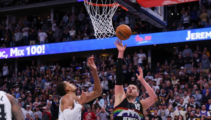 Denvers Nikola Jokic scores against Victor Wembanyama in the Nuggets NBA overtime win over the San Antonio Spurs. —AFP