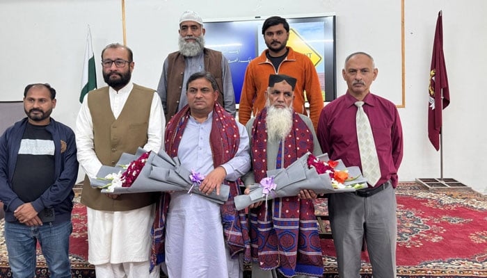 Amjad Ali Awan, Associate Professor of Psychology and Chairman of the Department at Islamabad Model College for Boys H-9 (centre), poses for a photo in this image on March 13, 2026. — Facebook@javaidiqbalmughal3