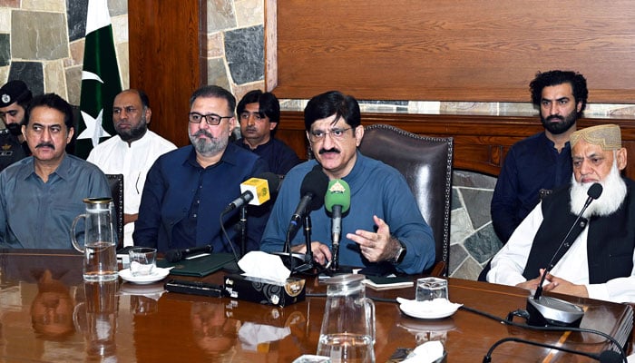 Sindh Chief Minister Syed Murad Ali Shah, flanked by provincial ministers and transporters’ office-bearers, addresses a press conference at CM House on April 5, 2026. — Facebook@SindhCMHouse