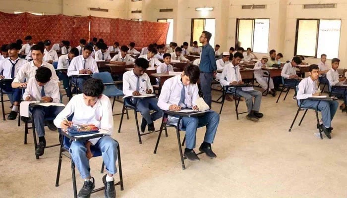 Students of the matric class are solving papers in the examination centre during the Annual Examination of Matriculation. — PPI/File