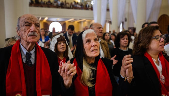 Lebanese Christians praying on the eve of Easter Sunday. — AFP/File