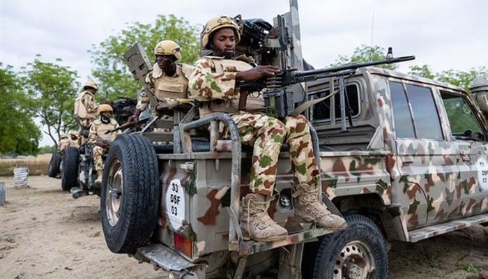 A Nigerian soldier loads his machine gun during training at the Multinational Joint Task Force military base, Sector 3 Headquarters, in Monguno, Borno state, Nigeria. —AFP