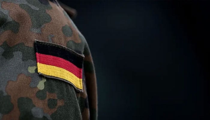 A soldier of the German armed forces wears the German flag on his uniform. — AFP/File