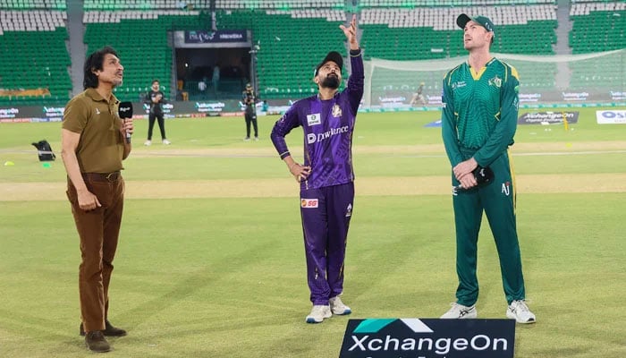 Quetta Gladiators captain Saud Shakeel (centre) flips the coin as Multan Sultans Ashton Turner (right) makes the call at the toss for their PSL 11 match at the Gaddafi Stadium in Lahore on April 5, 2026. — PCB