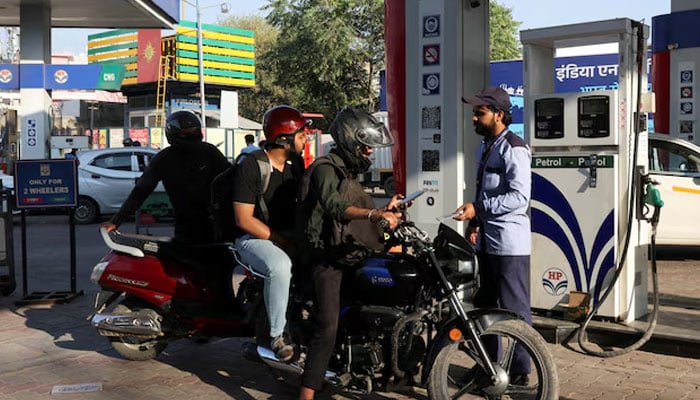 A man pays after refuelling his bike at a fuel station in New Delhi, India, March 6, 2026.—Reuters