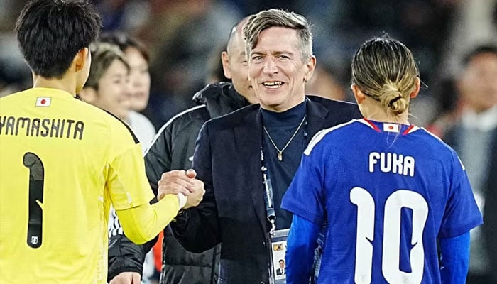 Japan womens head coach Nils Nielsen celebrates their November home win over Canada.—AFP