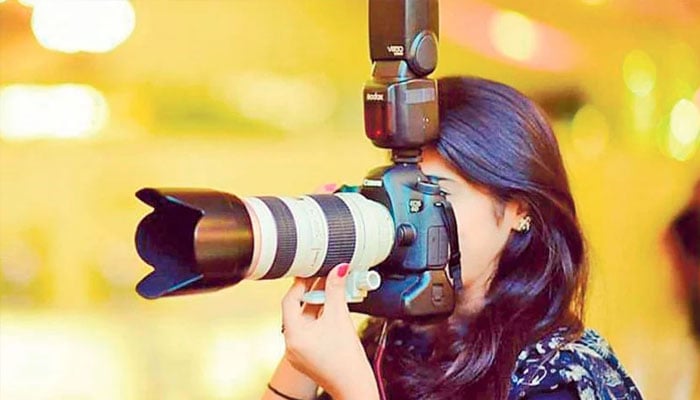 Representational image of a photographer taking a picture. —TheNews/File