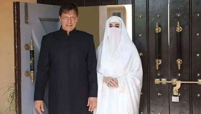 Former prime minister Imran Khan with his wife Bushra Bibi. — X/@PTIofficial/File
