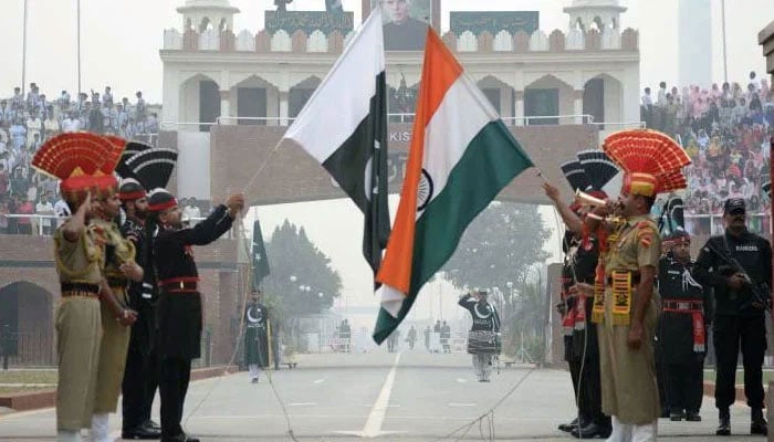 Pakistani and Indian soldiers take part in the flag-lowering ceremony at the Pak-India Wagah Border. — AFP/File