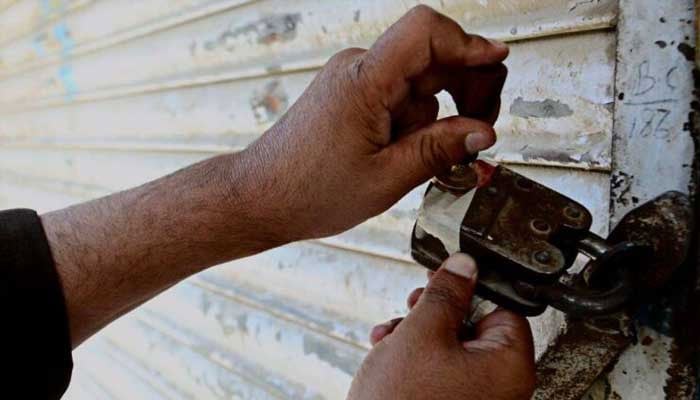 A representational image of a building being sealed by authorities. — APP/File