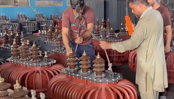 The representation image shows technicians working on a transformer at a factory. — YouTube/Amazing Technology/Screengrab