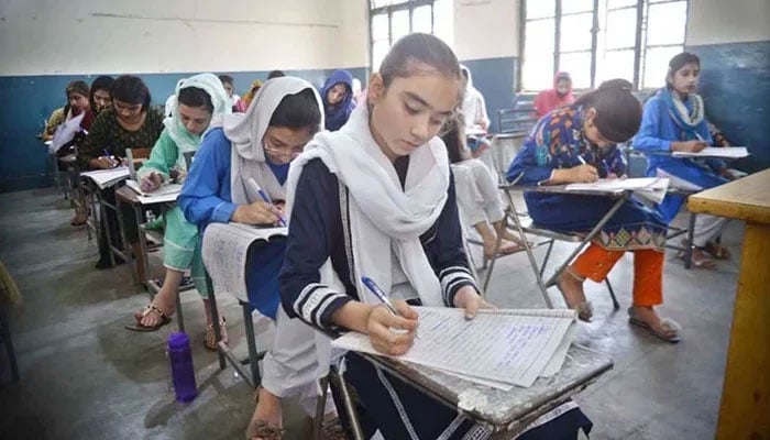 Girls seen amid an exam at a government school in Peshawar. — Reuters/File
