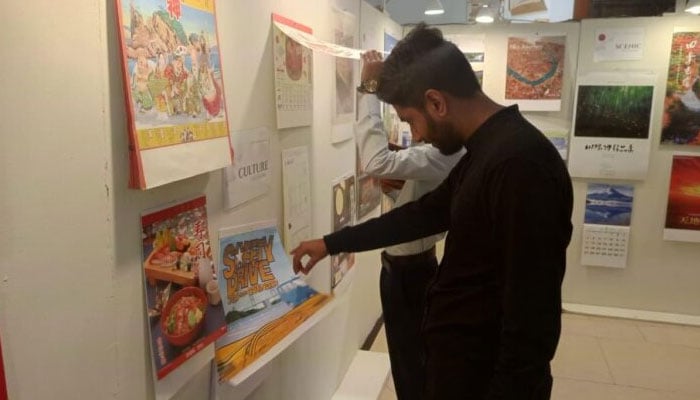 The representational image shows people appreciating different masterpieces at an exhibition. — Facebook@JapaneseConsulateKarachi/File