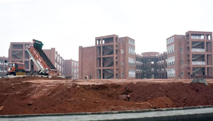 Labourers are seen at the construction site of the Danish School at Kuri Road in the Federal Capital on January 1, 2026. — Online