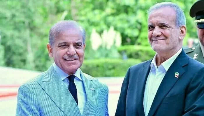 This undated image shows Iranian President Masoud Pezeshkian receiving Prime Minister Shehbaz Sharif at Saadabad Palace in Tehran, Iran. — X/@PTVNewsOfficial