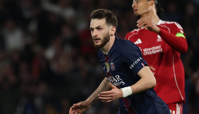 Khvicha Kvaratskhelia heads off to celebrate after scoring Paris Saint-Germains second goal in their Champions League quarter-final first leg against Liverpool. —AFP