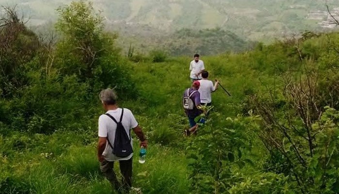 The image shows a sight of people hiking on the Margalla Hills.   — Facebook@Mudassir Hussain Tarar