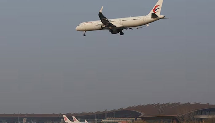 A plane of China Eastern Airlines lands at the Beijing Capital International Airport in Beijing, China March 23, 2022.—Reuters
