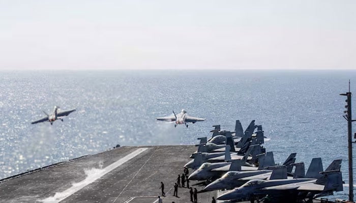 Two F/A-18 Super Hornets launch from the flight deck of the US Navy Nimitz-class aircraft carrier USS Abraham Lincoln in support of the Operation Epic Fury attack on Iran from an undisclosed location March 3, 2026.—Reuters