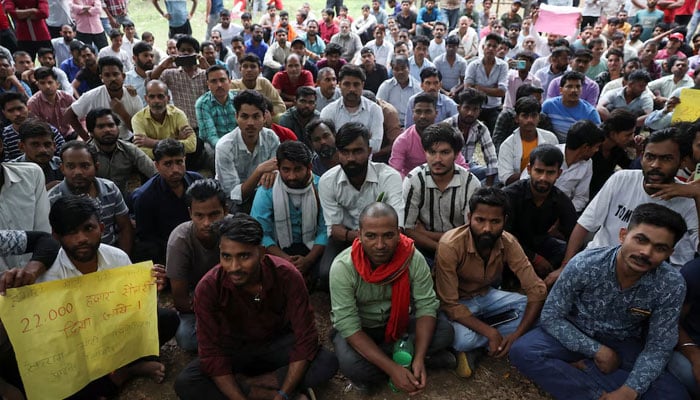 Factory workers hold a protest demanding wage hikes from their company, in Manesar, Haryana, India, April 7, 2026. — Reuters