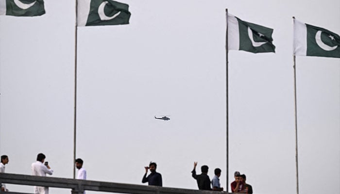A helicopter flies over the Red Zone in Islamabad on April 10, 2026. — AFP
