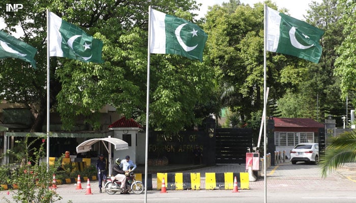 A view of the Pakistani flags hoisting on Constitution avenue on the eve of 1 round of for US- Iran talks in capital city. Pakistan holds US, Iran to Direct Talks in Islamabad on Ceasefire on 11 April, 2026. — INP