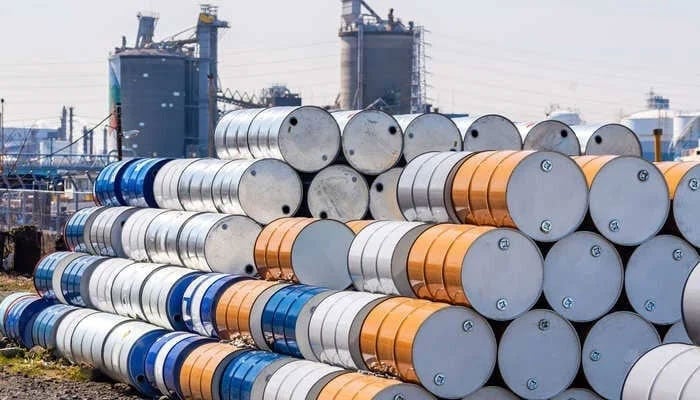 Crude oil barrels staked at a refinery can be seen. — APP/File