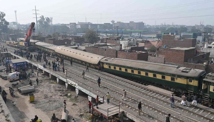 The representational image shows Rescue workers and railway personnel using a crane to clear the tracks after a train derailed near Lahore on January 31, 2025. — AFP