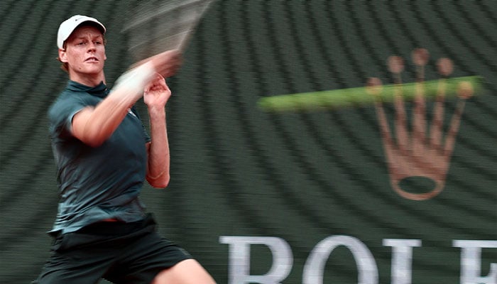 Italys Jannik Sinner plays a forehand return to Canadas Felix Auger-Aliassime during the Monte Carlo ATP Masters Series Tournament quarter final tennis match on Court Rainier III at the Monte-Carlo Country Club in Roquebrune-Cap-Martin, south-eastern France on April 10, 2026. — AFP
