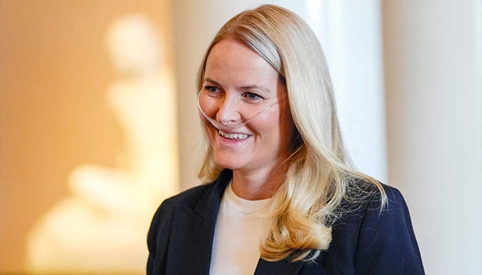 Crown Princess Mette-Marit of Norway smiles as she arrives for a reception for the Norwegian athletes from the Paralympics in Milano Cortina 2026 at the Palace on April 10, 2026. — AFP
