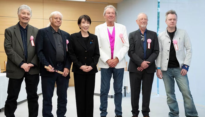 Japans Prime Minister Sanae Takaichi poses with members of British rock band Deep Purple, Don Airey, Ian Paice, Ian Gillan, Roger Glover and Simon McBride during their meeting at the Prime Ministers Office in Tokyo, Japan, April 10, 2026. — Reuters